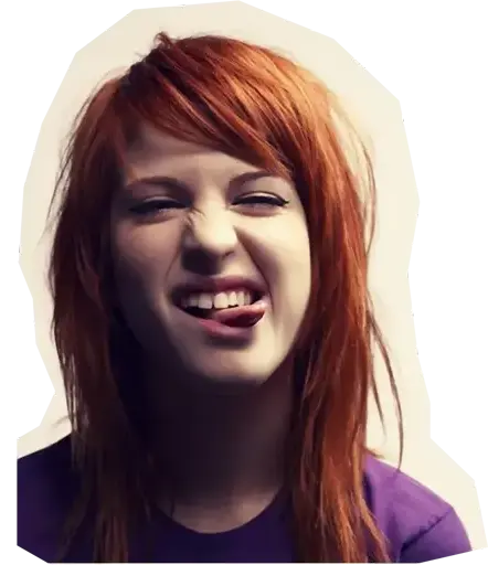 woman with orange hair scrunching her face sticking her tounge out